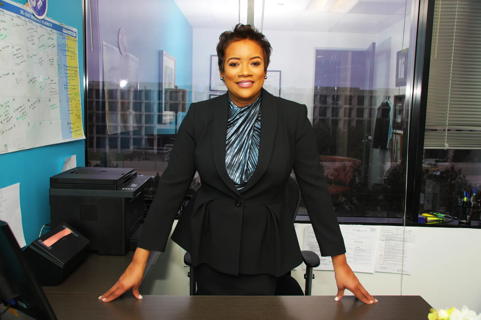 Attorney Katrina Patrick standing in her office